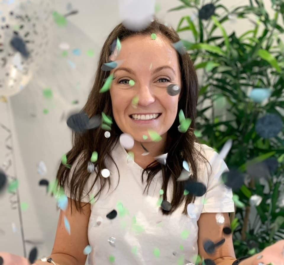 OH NINE Founder Summer Priest Bookkeeper smiling with confetti